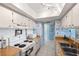 Bright kitchen featuring white cabinets, wood countertops, and white appliances at 450 S Gulfview Blvd # 605, Clearwater Beach, FL 33767