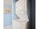 Convenient in-unit laundry featuring a stacked washer and dryer at 450 S Gulfview Blvd # 605, Clearwater Beach, FL 33767