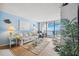 Inviting living room with sliding glass doors that open to a balcony with stunning ocean views at 450 S Gulfview Blvd # 605, Clearwater Beach, FL 33767