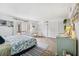 Spacious main bedroom with a patterned bed, beach-themed decor, and ample closet space at 450 S Gulfview Blvd # 605, Clearwater Beach, FL 33767