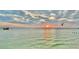 Picturesque ocean view at sunset with boats on the horizon at 450 S Gulfview Blvd # 605, Clearwater Beach, FL 33767