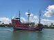 Large pirate ship sailing on the water near the shore, filled with people enjoying the ride at 450 S Gulfview Blvd # 605, Clearwater Beach, FL 33767