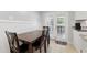 Cozy dining area with a wooden table, chairs, and french doors leading to the patio at 4624 Belfast Dr, New Port Richey, FL 34652