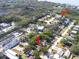 Aerial view pointing to the home near Pinellas Trail, surrounded by verdant landscape at 510 1/2 Ulelah Ave, Palm Harbor, FL 34683