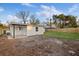 Backyard shows a tiled patio with a newly fenced in yard at 5220 Pine St, Seffner, FL 33584