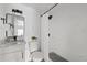 Bathroom featuring granite vanity and modern shower at 5220 Pine St, Seffner, FL 33584