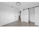 Bright bedroom featuring a sliding closet door and ensuite bathroom at 5220 Pine St, Seffner, FL 33584