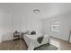 Bright bedroom featuring stylish accent wall and plush bedding at 5220 Pine St, Seffner, FL 33584