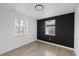 Well-lit bedroom showcasing modern paint and hardwood flooring at 5220 Pine St, Seffner, FL 33584