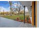 Home features a cute porch with a decorative tile entrance and landscaped yard at 5220 Pine St, Seffner, FL 33584