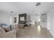 Open-concept living area showcasing sleek flooring and modern design elements at 5220 Pine St, Seffner, FL 33584