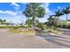 Well-manicured entrance to Treviso community with lush landscaping and mature palm trees at 541 Treviso Dr, Apollo Beach, FL 33572