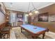 Spacious game room featuring a pool table and custom lighting at 541 Treviso Dr, Apollo Beach, FL 33572