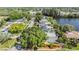 Birds-eye view of residential area with solar panels, pool, and lake access at 6041 16Th Ne Ln, St Petersburg, FL 33703