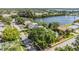 Overhead view of a residential neighborhood near a tranquil lake, featuring mature trees at 6041 16Th Ne Ln, St Petersburg, FL 33703