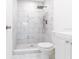 Modern bathroom featuring a marble-tiled shower with rain shower head at 6906 N Lynn Ave, Tampa, FL 33604
