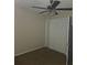 Cozy bedroom showcases neutral carpeting, a ceiling fan, and a closet for ample storage at 70 Durham Ct, Palm Harbor, FL 34683