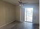 Bedroom with a sliding glass door, ceiling fan, and ready for your personal touches and design ideas at 70 Durham Ct, Palm Harbor, FL 34683