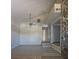 Spacious living room with high ceilings, ceiling fan, natural light, and a striking stone fireplace at 70 Durham Ct, Palm Harbor, FL 34683