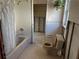 Dated bathroom with a tub shower, toilet, and partially removed walls needing renovation at 701 64Th Ave, St Pete Beach, FL 33706