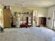Spacious area, possibly a garage, showing water heater and storage, needing renovation at 701 64Th Ave, St Pete Beach, FL 33706