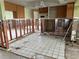 Kitchen and living room area with partially removed drywall showcasing the studs at 701 64Th Ave, St Pete Beach, FL 33706