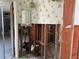 Kitchen renovation showing exposed wall studs and plumbing with an open doorway to the garage at 701 64Th Ave, St Pete Beach, FL 33706