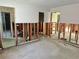 Living room renovation displays wall studs, missing drywall, and open doorways in a home at 701 64Th Ave, St Pete Beach, FL 33706