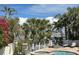 Inviting pool and spa area with a waterfront view and comfortable lounge chairs at 701 64Th Ave, St Pete Beach, FL 33706