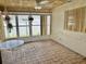 Sunroom with large windows, tile flooring, and hanging plants at 701 64Th Ave, St Pete Beach, FL 33706