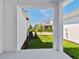View of backyard and neighboring houses from porch at 7258 Kodiak Ln, Sarasota, FL 34240