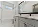 Modern bathroom with dual sinks, white subway tile shower, and stylish black hardware at 7258 Kodiak Ln, Sarasota, FL 34240