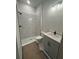 Bathroom features a tiled walk-in shower with modern fixtures and vanity at 7258 Kodiak Ln, Sarasota, FL 34240