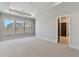 Bright bedroom with carpeted floors, recessed lighting and three windows at 7258 Kodiak Ln, Sarasota, FL 34240