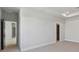 Bright bedroom with neutral carpet and trim plus open doorway and recessed lighting at 7258 Kodiak Ln, Sarasota, FL 34240