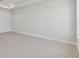 Spacious bedroom features neutral carpet, white trim, and ample natural light at 7258 Kodiak Ln, Sarasota, FL 34240
