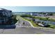 Beautiful community with a lake view and lush landscaping near Emerald Landing sign and elegant buildings at 7258 Kodiak Ln, Sarasota, FL 34240