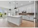 Modern kitchen featuring a center island, white cabinetry and stainless steel appliances at 7258 Kodiak Ln, Sarasota, FL 34240
