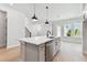 Bright, modern kitchen with a large island, stainless steel appliances, and pendant lighting at 7258 Kodiak Ln, Sarasota, FL 34240
