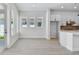 An open-concept room filled with natural light through large windows and a glass door at 7258 Kodiak Ln, Sarasota, FL 34240