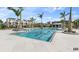 A refreshing swimming pool next to community residences on a bright, sunny day at 7258 Kodiak Ln, Sarasota, FL 34240