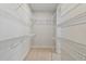 Walk-in closet provides ample storage space with installed wire shelving system at 7258 Kodiak Ln, Sarasota, FL 34240