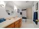 Well lit bathroom with vanity, large mirror, tub and shower at 8003 Bardmoor Pl # 204, Seminole, FL 33777