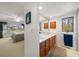 Bathroom featuring a vanity with double sinks, a large mirror and a window at 8003 Bardmoor Pl # 204, Seminole, FL 33777