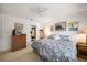 Cozy bedroom features wicker furniture, nautical artwork, and a bright, airy ambiance at 8003 Bardmoor Pl # 204, Seminole, FL 33777