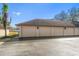 Spacious garage featuring three bays, neutral paint, and decorative exterior lighting at 8003 Bardmoor Pl # 204, Seminole, FL 33777