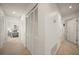 Hallway leading to bedrooms with ample closet space for organized storage at 8003 Bardmoor Pl # 204, Seminole, FL 33777