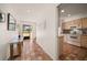 Tiled hallway with kitchen access and view to front door at 8003 Bardmoor Pl # 204, Seminole, FL 33777