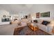 Bright living room with vaulted ceilings, fireplace, and comfortable seating area at 8003 Bardmoor Pl # 204, Seminole, FL 33777