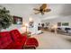 Cozy living room with comfortable seating, fireplace, and adjacent dining area at 8003 Bardmoor Pl # 204, Seminole, FL 33777
